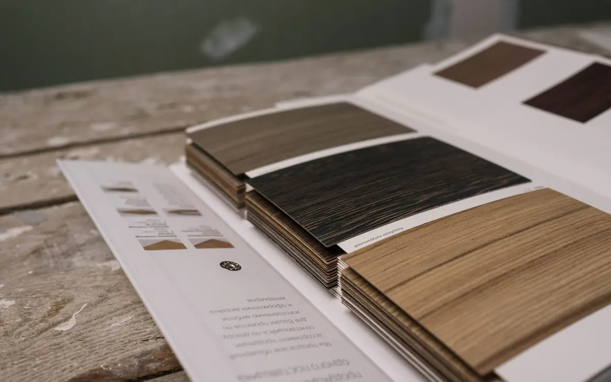 Roofing and siding material samples laid out on a table