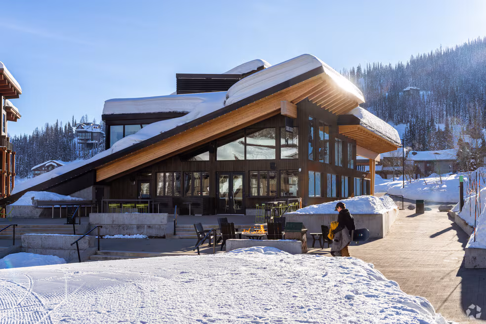 Winter scene at a snow-covered dock and shoreline on Lake Pend Oreille